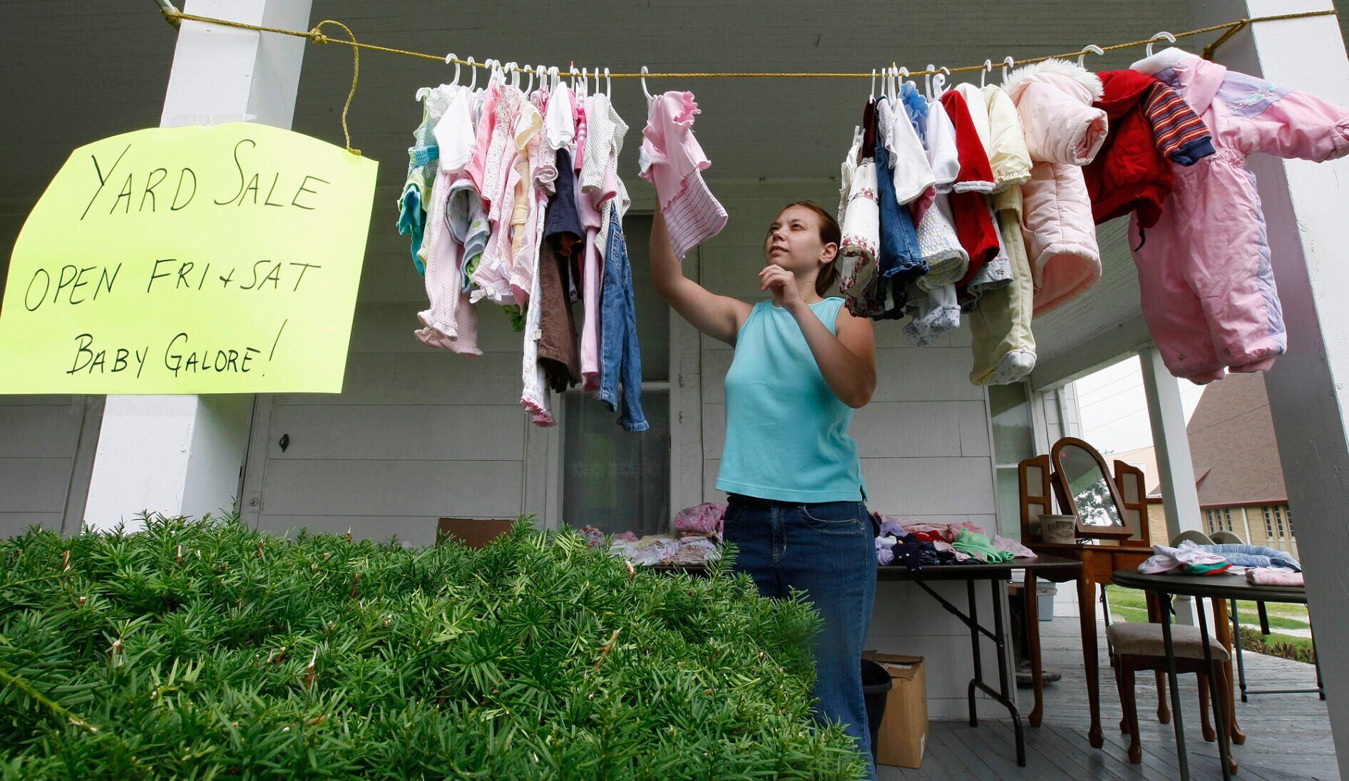 Put baby clothes and toys near the back of the sale.